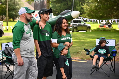 Curtis Martin Congratulates Cindy and Family for Winning the Pepsi Homegate Experience (Photo by Theo Wargo/Getty Images for Pepsi)