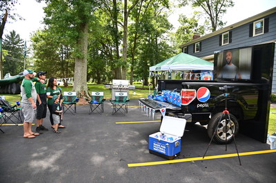Curtis Martin Congratulates Cindy and Family for Winning the Pepsi Homegat Experience (Photo by Theo Wargo/Getty Images for Pepsi)