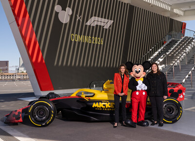 President of Disney Consumer Products, Tasia Filippatos, Mickey Mouse and Chief Commercial Officer of Formula 1, Emily Prazer, pose in front of a Disney x F1 race car at the Grand Prix Plaza in Las Vegas on May 19 to celebrate the official collaboration announcement. (Tony Rodriguez, photographer)