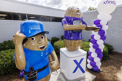 Comcast unveils two new peanut sculptures outside the Oates Street Xfinity Store in Dothan, AL on Wednesday, Oct. 8, 2025. These new peanut sculptures join more than 100 others as part of Dothan’s iconic “Peanuts Around Town” public art project.