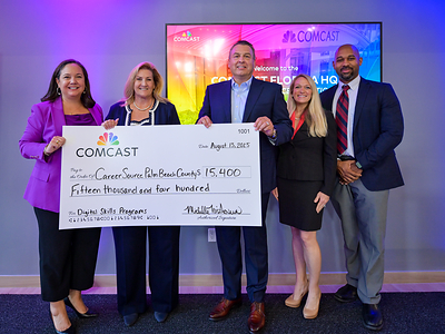 Comcast leaders present CareerSource Palm Beach County with $15k to support digital skills programming.