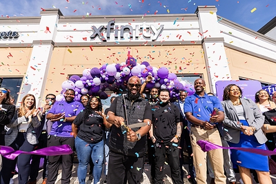 Xfinity and Comcast employees marked the first day of summer with a ribbon-cutting celebration for the grand opening of the newest Xfinity store in Tucker, GA. (PRNewsfoto/Comcast)