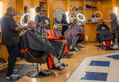 Members of Louisiana's military community receive complimentary haircuts during the 5th Annual Free Haircut Giveaway, sponsored by Comcast.