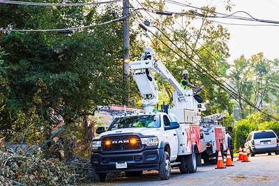 Comcast technicians repair damage post-storm.