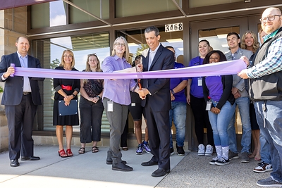 From left to right: Jeff Snyder, Government Affairs Manager, Comcast; Tamara Weaver, Xfinity Store Manager; Craig D'Agostini, Vice President of Government Affairs, Comcast; and Brenton Heykoop, Assistant Xfinity Store Manager cut the ribbon in front of the new Xfinity Store in Kentwood, Michigan