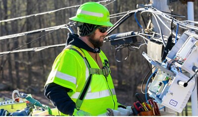A Vermont technician works on Comcast's latest expansion in the state.