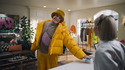 Will Ferrell buying a new outfit and earning cash back when he pays with PayPal in-store.