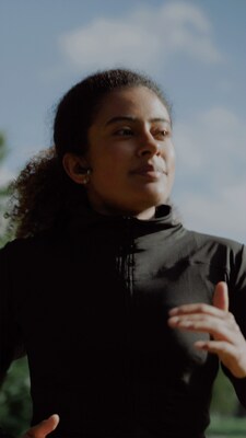 Woman exercising before enjoying a Clif bar.