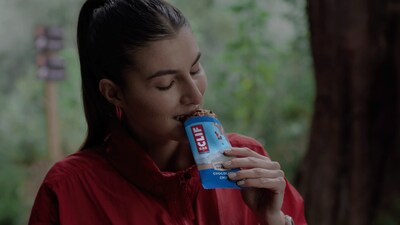 Woman enjoying Clif Bar post-workout.