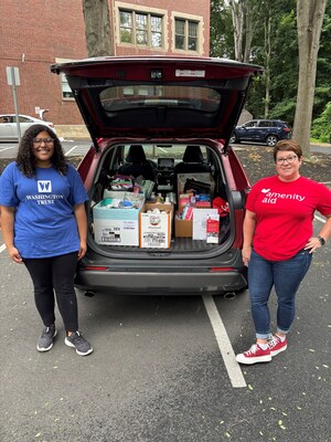 Pictured are Maraynah Vasconcelos, volunteer for Washington Trust (l) and Kelly West, Amenity Aid Board of Directors (r) with a carload of donated hygiene items.