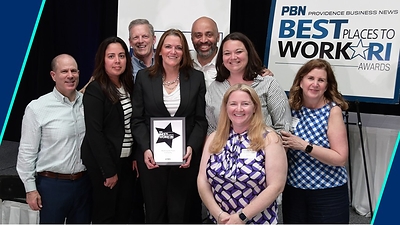 Washington Trust team members proudly display the 2025 Best Places to Work Award, marking the company's fifteenth consecutive year of recognition by Providence Business News.