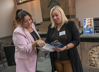 Washington Trust Community Lending Officer, Rosa Pastor (left), discusses the Bank’s RI Community Lending Program with local realtor, Virgen Nieves of Keller Williams® Coastal, at an educational event for Rhode Island real estate professionals at La Casona Restaurant in Central Falls, R.I.