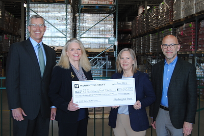 Washington Trust employees, customers and community members raised $13,590 to support the Rhode Island Community Food Bank during the Bank's 22nd annual Peanut Butter Drive. Pictured are Washington Trust representatives Edward O. 