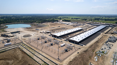 In June, the remaining tanks and miners in Building A1 were energized, resulting in completion of the first 100 MW building in Corsicana. Additionally, during the month, Building A2 was nearly completed with nearly all immersion tanks and miners in the building now operational.  

Development for the third building at Corsicana, Building B1, continued on schedule with the building structure now fully erected and concrete slab pouring in progress. Installation of immersion tanks has begun and