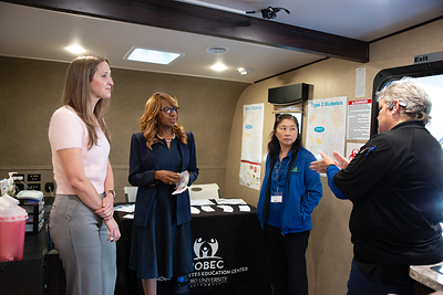 From left: Julianne Lally and Dr. Eagilen chat with Anne Lee, Diabetes Program Manager, and Deanna Dickey, Operations Manager and Event Coordinator, MOBEC, inside the new mobile clinic.