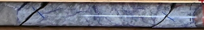 Figure 17: Pollucite with lepidolite veining (purple) in grey quartz matrix from 139.3 m to 139.5 m in drill hole CV24-520 (Vega Zone), within a wider zone of caesium mineralization grading 7.39% Cs2O over 7.1 m. [ (6) See news release dated April 9, 2025. ] (CNW Group/Patriot Battery Metals Inc.)