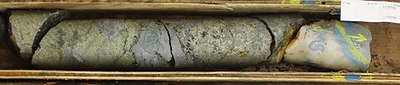 Figure 5. Photos of drill core from hole AR22-0237 showing massive and semi-massive sulphide bands. Close-up photo of exceptionally well mineralized interval  from Zone 5 consisting of medium-grained chalcopyrite with finer-grained interstitial sphalerite hosted within a quartz mica schist cut by quartz vein. Results for sample number 1159796, from 87.83 meters to 88.50 meters, are 15.1% copper, 13.3% zinc, 2.2% lead, 160 g/t silver and 2.7 g/t gold; part of the 10-meter interval of 5.66% copper equivalent reported in Table 1. (CNW Group/Trilogy Metals Inc.)