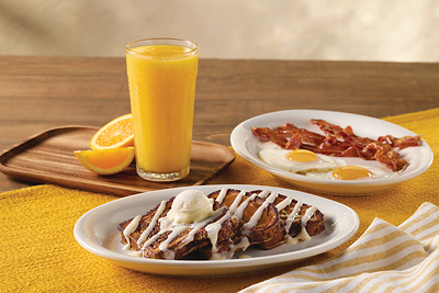 Cinnamon Swirl French Toast Breakfast: Cinnamon streusel bread, hand-dipped in Cracker Barrel’s signature batter and griddled golden brown, topped with rich cinnamon and cream cheese icings. Served with two eggs plus a choice of thick-sliced bacon or smoked sausage.