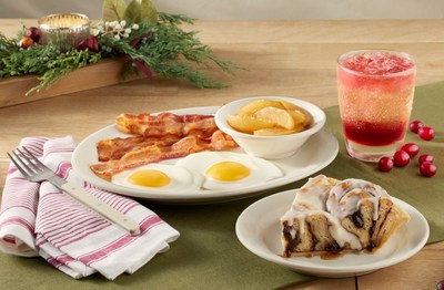 A seasonal favorite, Cinnamon Roll Pie Breakfast includes cinnamon rolls backed in a pie crust and drizzled with cream cheese icing, two eggs, choice of meat, and fried apples or hashbrown casserole. Pair this sweet dish with the new Glitter Globe Spritzer for an even more festive feeling!