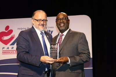 National Community Action Partnership's First Vice Chair, Rick Baker, from LKLP Community Action Council in Hazard, Ky., with Roddell McCullough of First Financial Bank.
