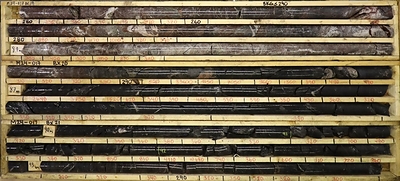 Figure 2: Radioactivity intersections (81.00 to 94.50 metres down hole) denoted as counts per second on the core boxes. Hangingwall quartzite (top core box) hosts intermittent radioactivity from 81.00 to 85.80 m. Continuous elevated radioactivity is hosted in the underlying graphitic pelite (bottom two core boxes). Core is NQ2 diameter, core box length is 1.50 m. (CNW Group/Fortune Bay Corp.)