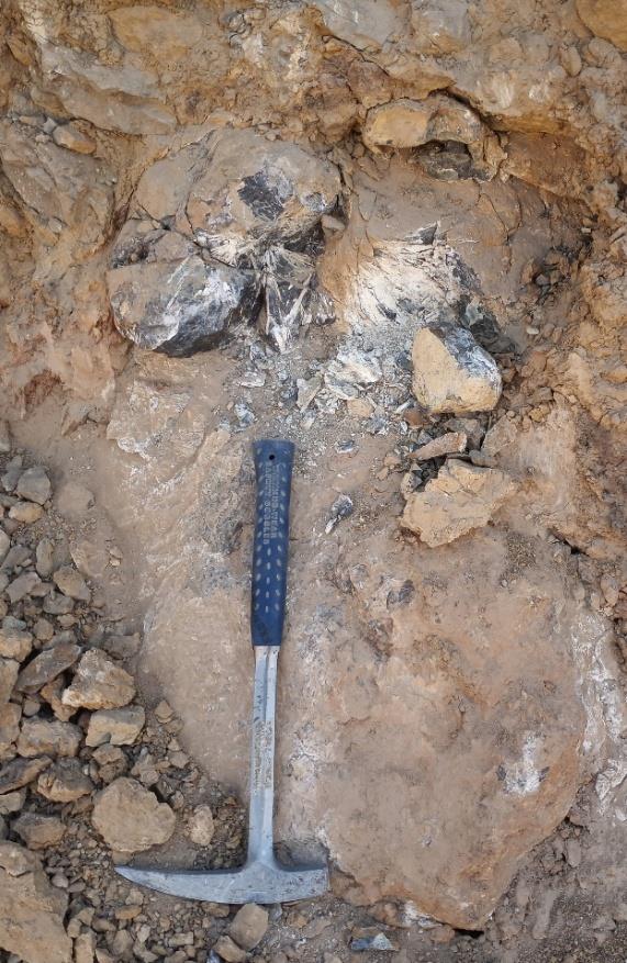 A hammer lying on the ground  AI-generated content may be incorrect.