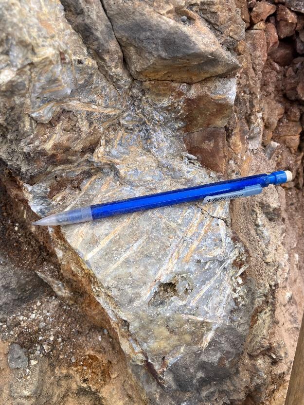 A blue pen on a rock  AI-generated content may be incorrect.