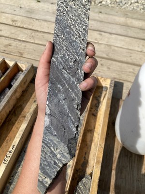 Photo 3. WPC22-07 - Banded 'Zebra' Mineralization: Bands of massive Fe-rich sphalerite and/or argentiferous galena between laminated dolomite crystals (CNW Group/Western Alaska Minerals Corp.)