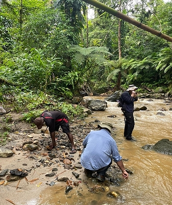 Figure 6.  Field reconnaissance underway on Feni Island project. (CNW Group/Adyton Resources Corporation)