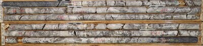 Figure 2 – Photo of drill core from PWM-24-211 displaying 8 meters of Pollucite from West Joe at the Company’s Case Lake Property, Ontario, Canada (CNW Group/Power Metals Corp.)