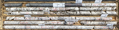 Figure 2 Aplite, spodumene and pollucite zones, including purple spodumene, West Joe Dyke, 26.8 – 34.88 m, PWM-22-150. (CNW Group/POWER METALS CORP)