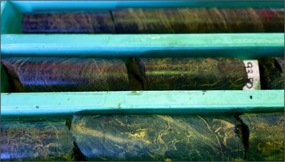 Figure 8. Example of banded semi-massive to vein magnetite-sulphide-siderite IOCG style mineralization in mafic schist host rock, AP024. (CNW Group/CopperCorp Resources Inc.)