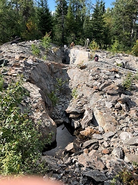 Photo 1: 80m long trench on the Rivard Property, looking back to the northwest along the strike of a gold-bearing vein (CNW Group/Trillium Gold Mines Inc.)