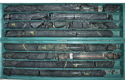 Figure 4: Great Pyramid diamond core (22GPRC021 186.40-193.15m), north of historic resource area. Grey to dark grey fine sandstone to siltstone with stockwork of fine quartz-chlorite/quartz pyrite (+/- cassiterite) veinlets, threads and fractures. Patches of sphalerite. Interval from 190 to 193 metres returned 0.56% tin and 0.54% zinc. (CNW Group/TinOne Resources Corp.)