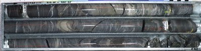 Figure 4: Great Pyramid diamond core (22GPRC014 218.25-220.65m), beneath historic resource area. Strongly sheeted quartz-carbonate veining in silicified, medium to coarse grained sandstones. Historical and current exploration indicates that veins of this style are cassiterite-bearing and are typical of the mineralised zones. Results pending. (CNW Group/TinOne Resources Corp.)