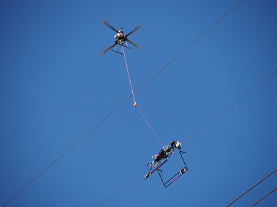 Utility lineworkers utilize the Mini LineFly™ to install PLP BIRD-FLIGHT™ Diverters on overhead power lines