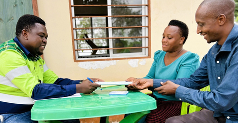 Figure 14: Signing of compensation agreements by a Physically Displaced Household, facilitated by Ramson Msemakweli, Resettlement Lead, June 2024.