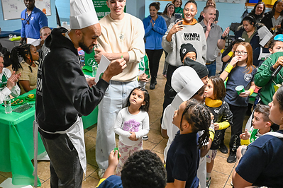 Derrick White and Hugo Gonzalez talk to kids about eating healthy at the Sun Life and Boston Celtics annual Fit to Win event at the East Boston YMCA.