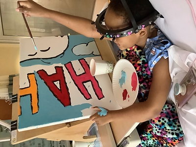 Flying High with Woodstock: Young patient Za’Naii Roundtree shows off her awesome painting skills as she contributes to a new Snoopy and Woodstock mural at Gillette Children’s in St. Paul, Minnesota—hometown of Peanuts creator Charles Schulz. The mural is one of 70 being donated to hospitals worldwide by Peanuts Worldwide and the nonprofit Foundation for Hospital Art as part of the global “Take Care With Peanuts” initiative, launched October 2in conjunction with the 70th Anniversary of Peanuts (CNW Group/Peanuts Worldwide)