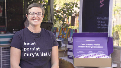 Miry Whitehill, of Miry's List, with a portion of Purple's donation of 6,000 pillows and sheets.