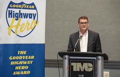 Gary Schroeder, executive director, Cooper Commercial at Goodyear, names Gerald “Andy” Wright the winner of the 2020-2021 Goodyear Highway Hero Award at a March 6 news conference from the Technology & Maintenance Council in Orlando, Fla. (Jessica Yanesh for Goodyear).