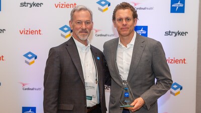 Peter Saviola (left), Medline vice president, national field sales, and Marc Phillips, Medline senior vice president, supply chain solutions, pose with the HIRC Highest Member Choice Award for Supplier Partnership.