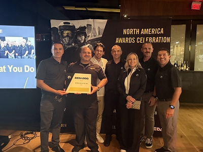 Jon Lester of RideNow Chandler receives the Sea Doo US National Dealer of the Year Award from representatives of BRP.