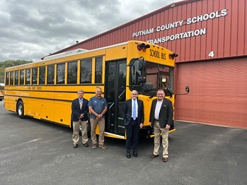 Putnam County Schools taking delivery of a GreenPower BEAST all-electric purpose-built school bus. In the photo are Bruce McGrew, Assistant Superintendent; Pat Clark, Director of Transportation; John Hudson, Superintendent and GreenPower Motor Vice President Mark Nestlen