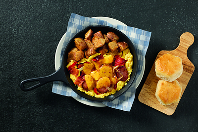 Cracker Barrel Campfire Breakfast Skillet – A camp-inspired breakfast skillet featuring bacon, smoked sausage, roasted red peppers and onions, topped with Colby cheese and served over three scrambled eggs, all seasoned with Cracker Barrel’s Campfire Seasoning.  The skillet is served alongside crispy Country Homestyle Potatoes, a brand-new side also seasoned with campfire spices.