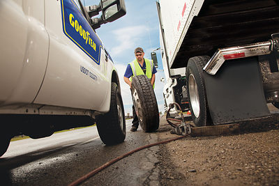 Goodyear Fleet HQ technician providing emergency roadside assistance for customer's fleet vehicle.