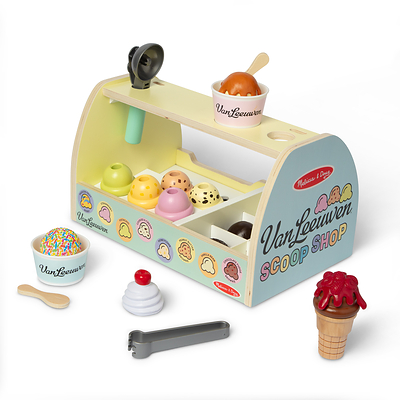 The Melissa & Doug x Van Leeuwen Scoop Shop Ice Cream Counter Play Set brings the ice cream shop experience home with 29 wooden play pieces, realistic scoop-and-stack action, pretend Van Leeuwen flavors, play money, and two coins redeemable for free kids' scoops. (CNW Group/Melissa & Doug)