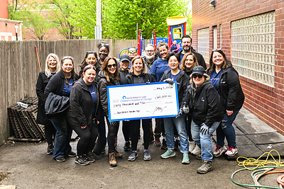 FirstService Residential presents check to Lurie Children's Hospital.