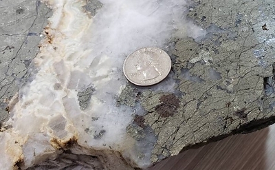 Jimenez and El Guadual show epithermal textures of symmetrical quartz banding and open space and bladed quartz. This later epithermal phase overprints two earlier phases of mesothermal mineralization and may explain the relatively higher-grade gold and enriched silver in this area. (CNW Group/Outcrop Silver & Gold Corporation)