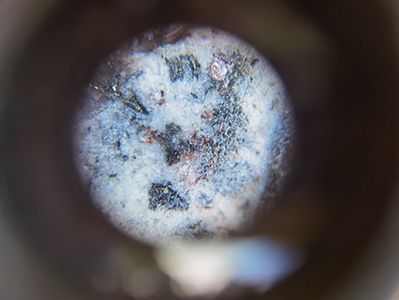 Course pyrargyrite (pinkish silver-rich sulfosalt) and native silver from the deepest core in San Juan. Native silver and pyrargyrite have only been observed in the deeper parts of San Juan, suggesting mineralization is open and silver may be enriched at depth. Assays pending. (CNW Group/Outcrop Silver & Gold Corporation)